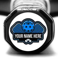 Personalized pickleball paddle tag with your name here on a blue paddle logo on a paddle end cap