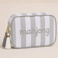 Grey and white striped Mahjong tile bag with a white tassel and embroidered mahjong lettering