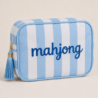 Light blue and white striped Mahjong tile bag with a blue tassel and embroidered mahjong lettering